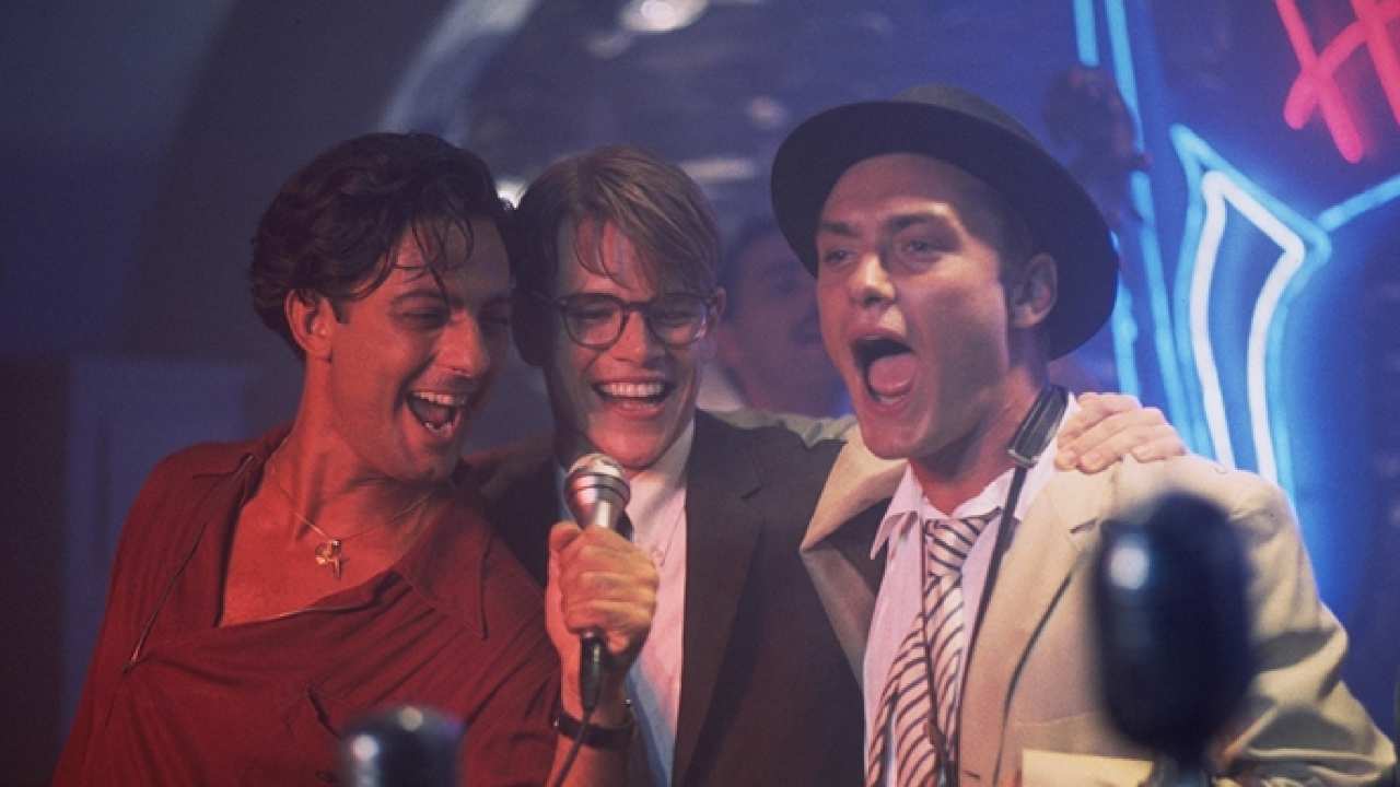 Matt Damon, Jude Law and a man singing